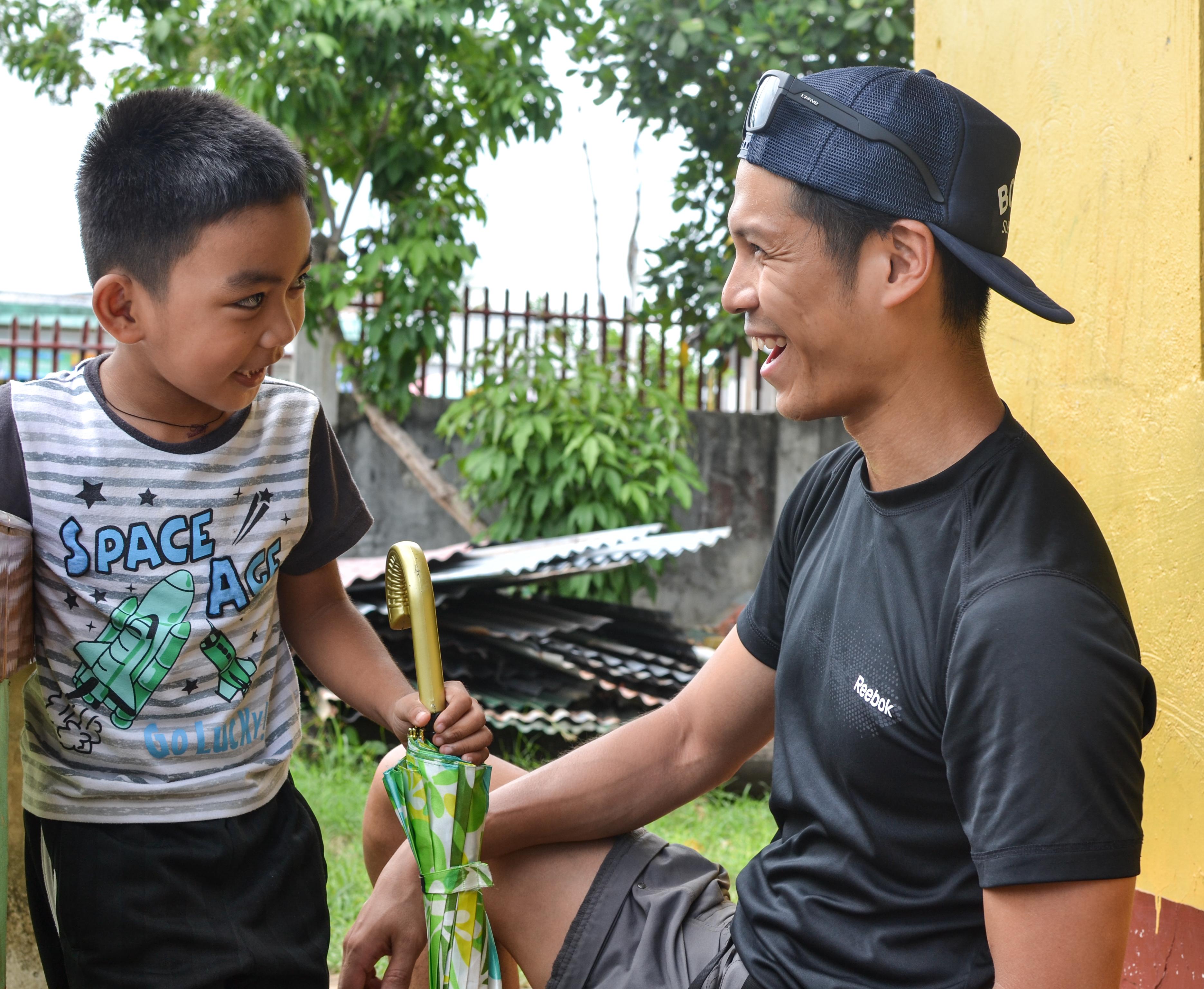 Projects Abroad intern having fun with a local child whilst on his physiotherapy internship in the Phillippines. A Projects Abroad male intern is pictured having fun with a local child whilst on his physiotherapy internship in the Phillippines.